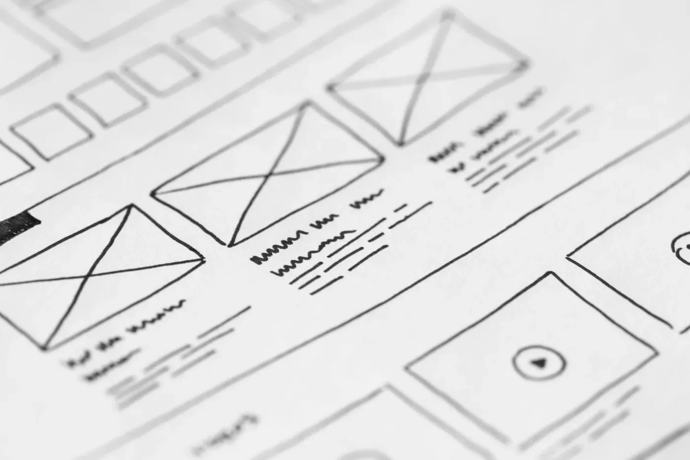A hand-drawn website wireframe sketched in pen on white paper.